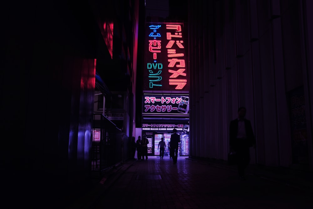 people walking in between high-rise building