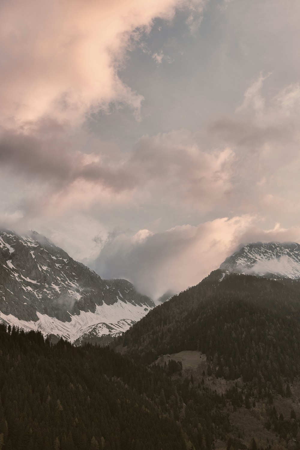 snow-covered mountains under white sky