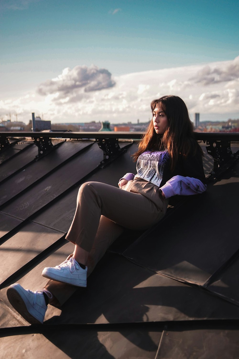 woman leaning on roof