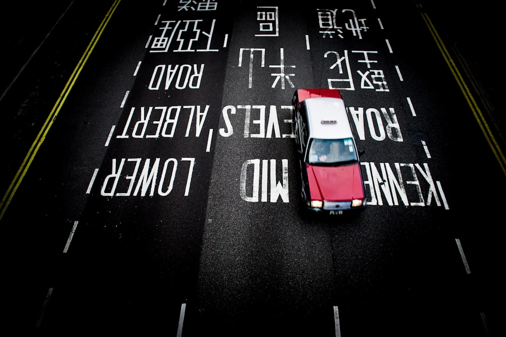 red and white car on road