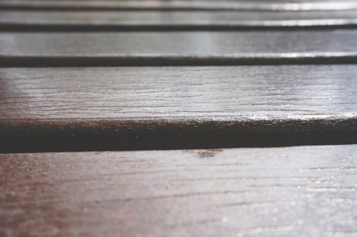 A close-up of laminate flooring showcasing its texture and finish.