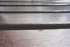 Close-up of freshly installed laminate flooring with natural wood grain texture.