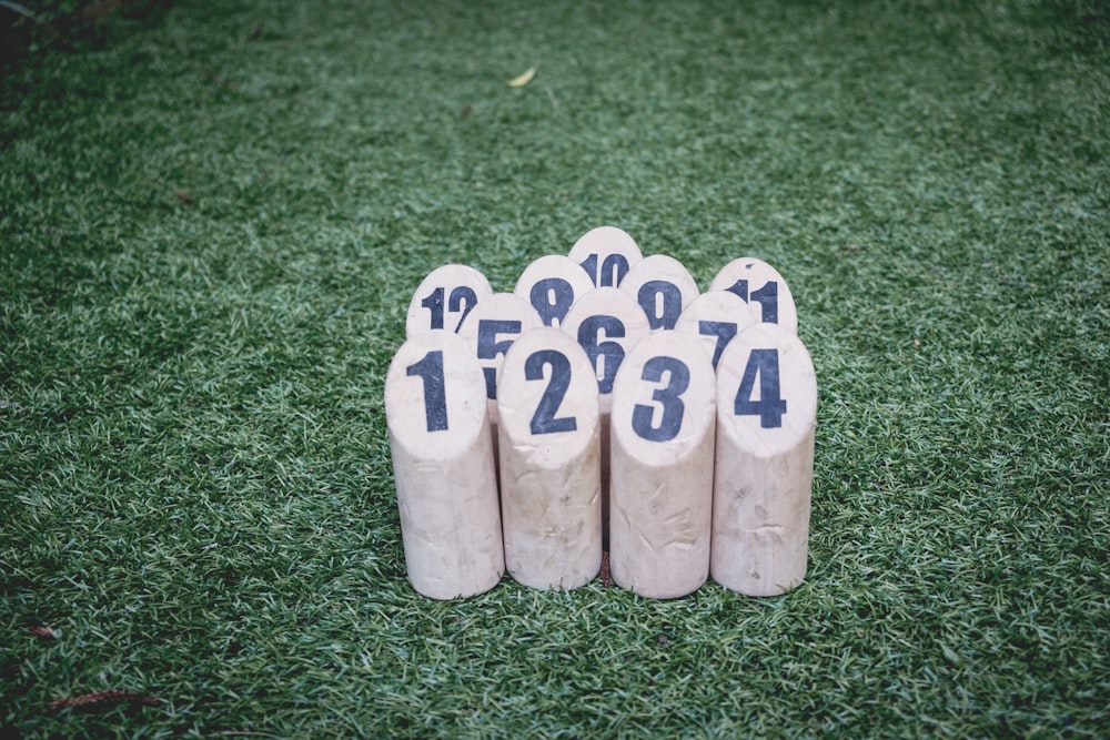 white wooden blocks on green lawn