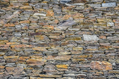 A beautifully crafted dry stone wall showcasing expert masonry.