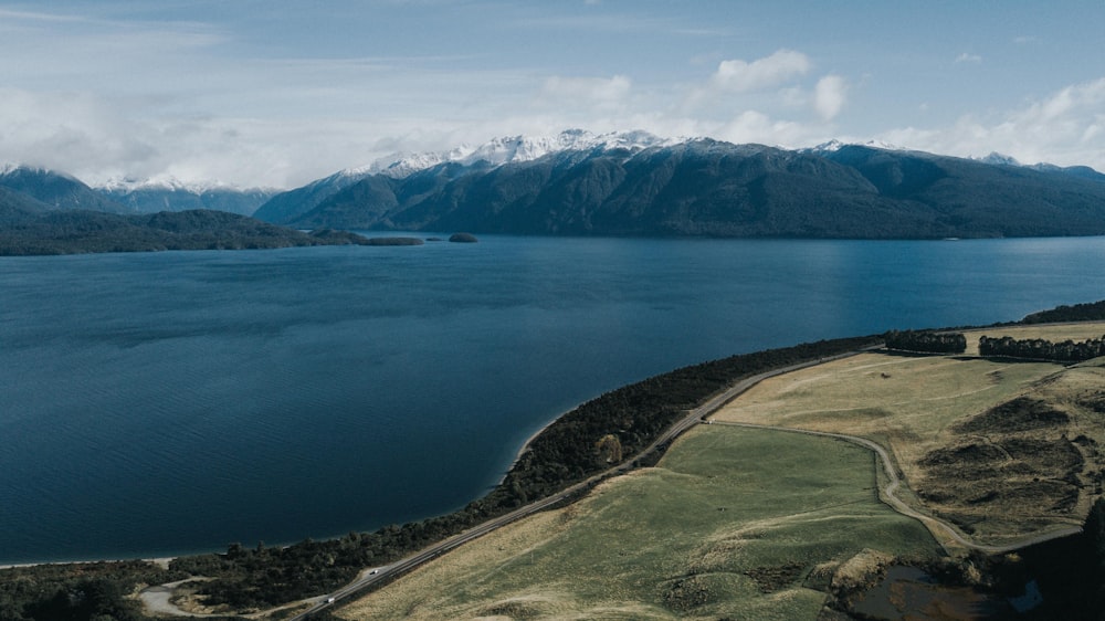 aerial photography of large body of water under gray sky