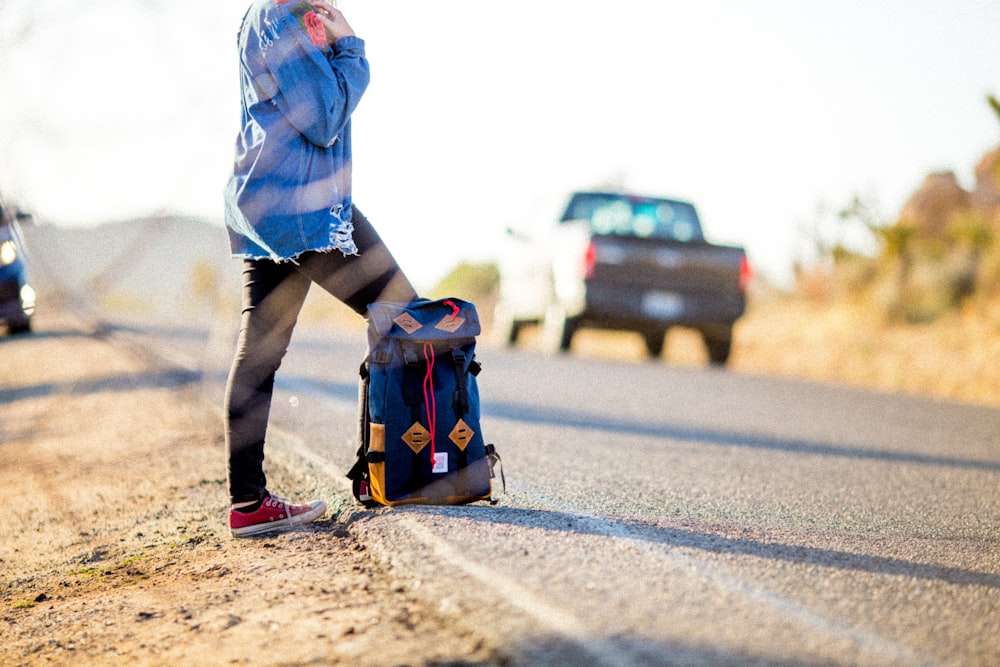 black and blue backpack on road