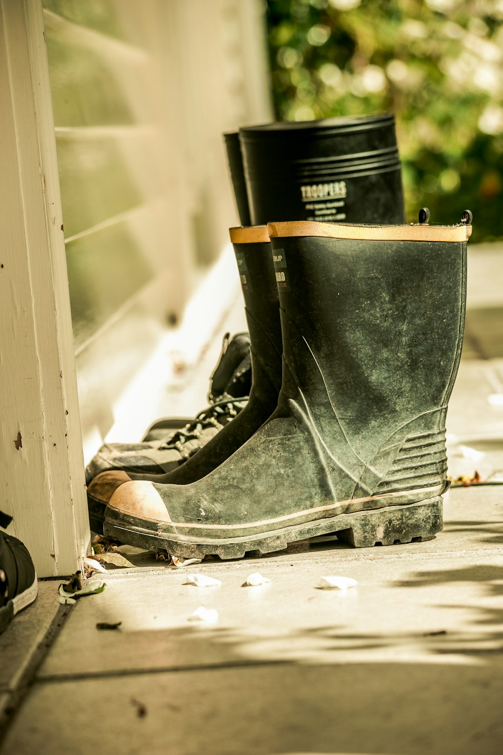 pair of black rain boots on floor