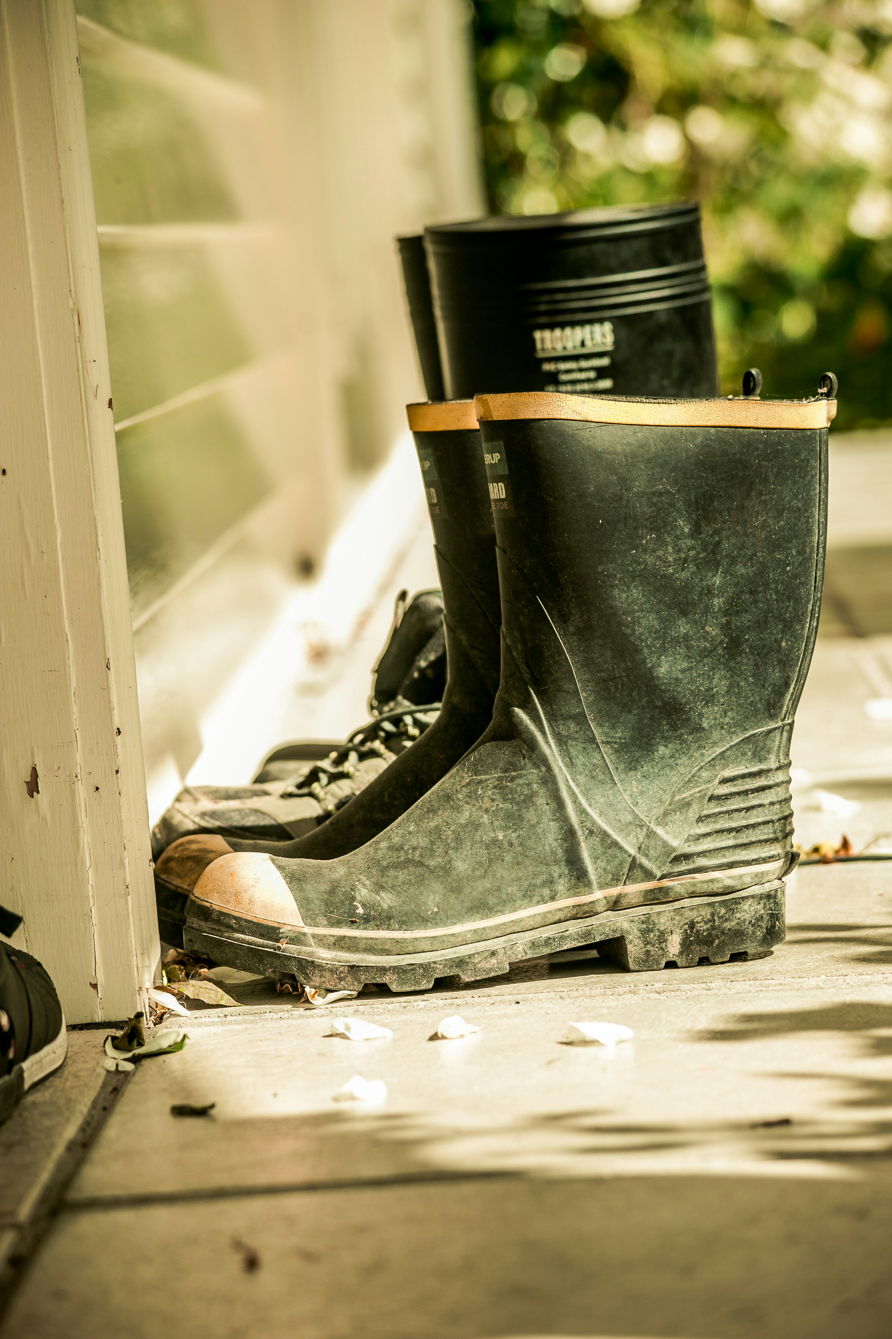 pair of black rain boots on floor