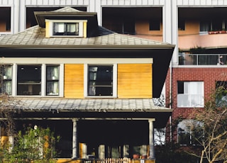 brown, white, and black house at daytime