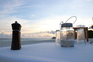 A serene beach-inspired table setting with decorative accents.