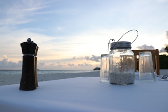 A serene beach-inspired table setting with decorative accents.