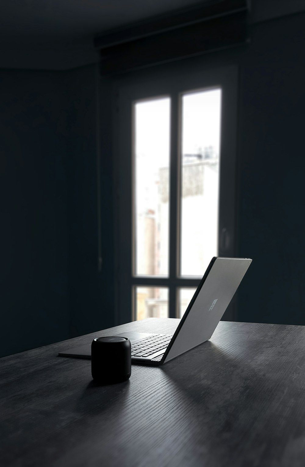 silver laptop computer and black camera lens