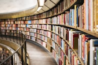 books on brown wooden shelf