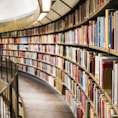 books on brown wooden shelf