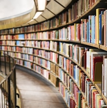 books on brown wooden shelf