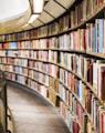 books on brown wooden shelf