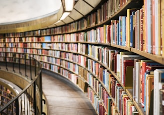 books on brown wooden shelf