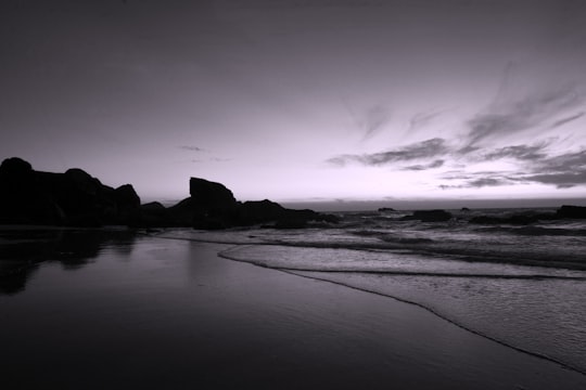 grayscale photography of sea in Cornwall United Kingdom