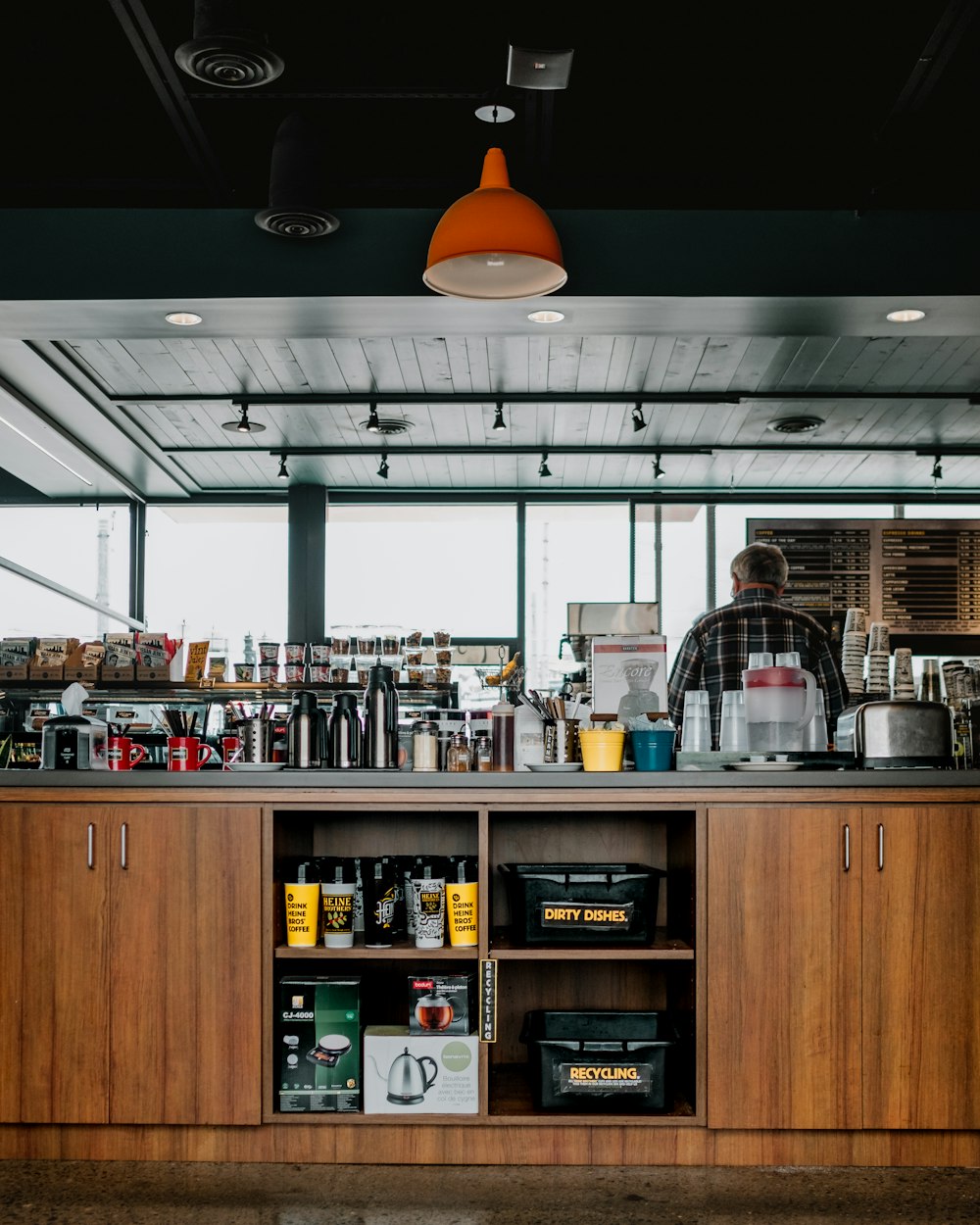 man standing on the kitchen inside the room