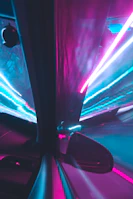 A vibrant synthwave-inspired backdrop with a shiny car parked, reflecting neon signs.