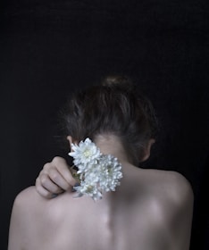 woman holding flower