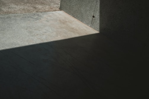 Minimalist frame showing a cinematic advertising scene with strong contrast