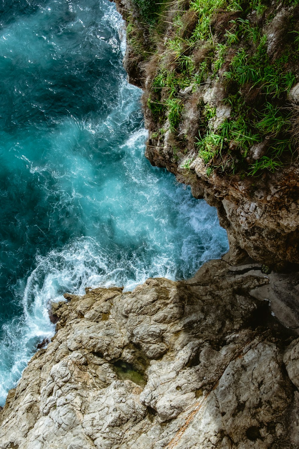 water waves hitting brown rock