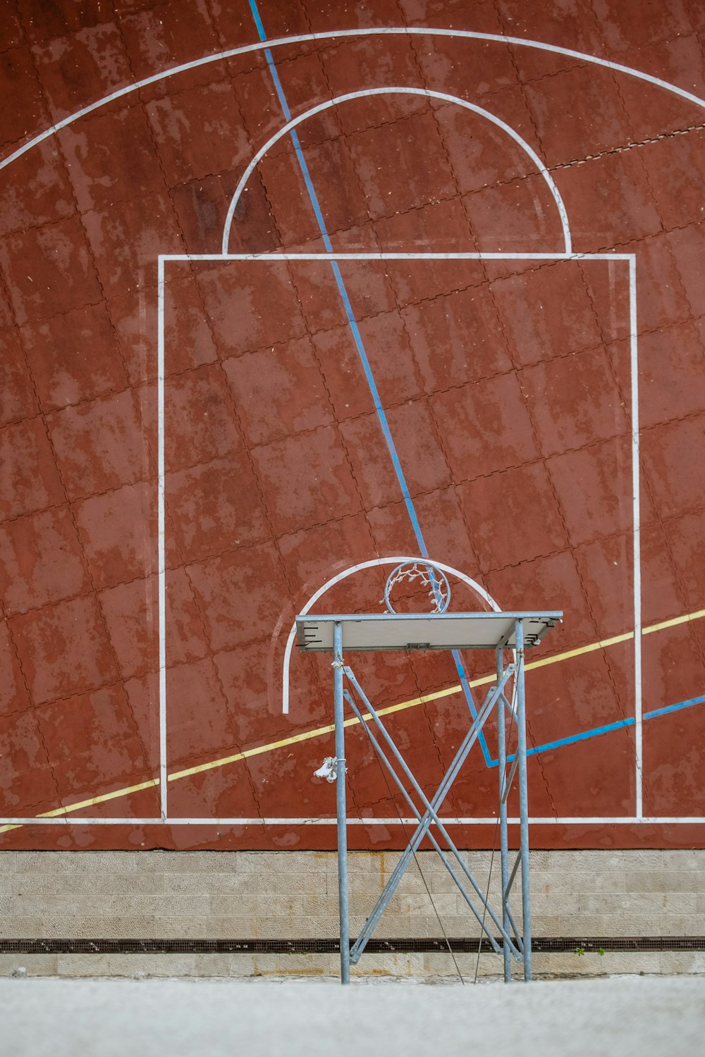 top view photography of white and gray basketball hoop and court