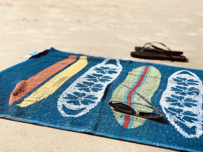 Rolled beach towels in a colour range