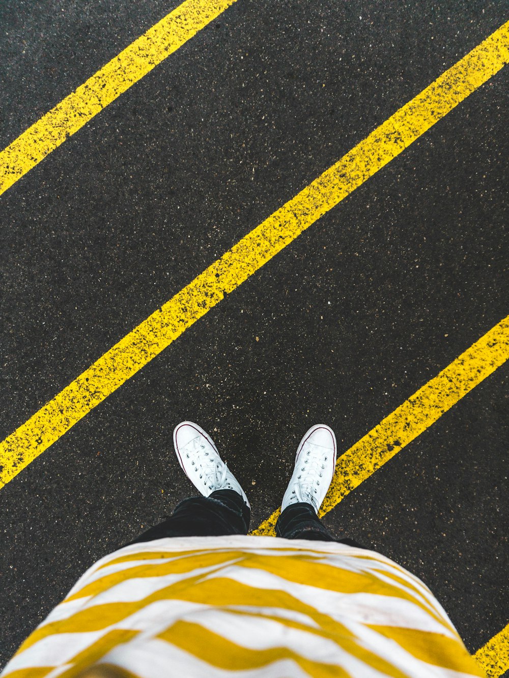 person standing on pedestrian lane