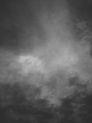 An artist's rendition of chaos and challenge symbolized by crossed sticks under moody skies.
