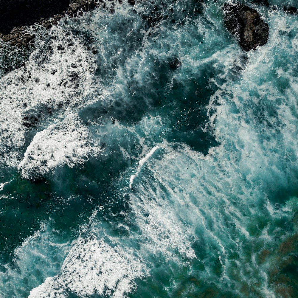 sea waves hitting rocky shores