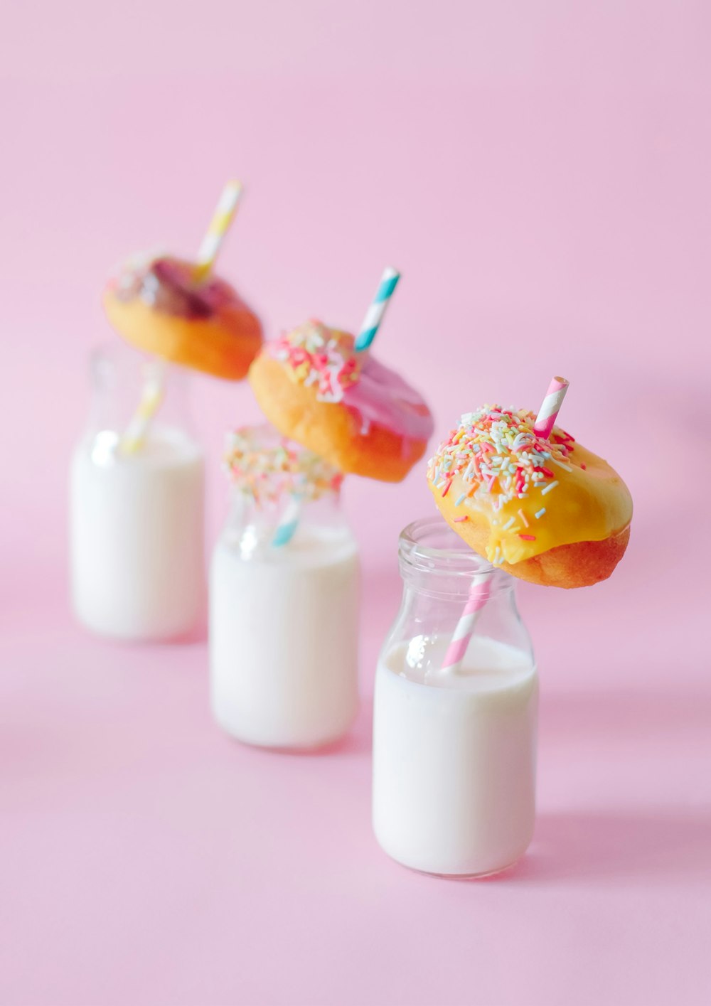 three milk jars and donuts