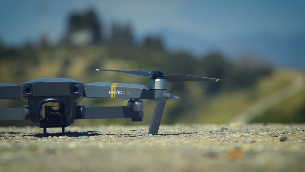 selective focus photography of DJI Mavic Pro drone on ground