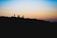 silhouette of people on a mountain