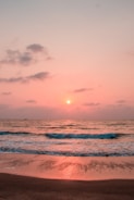 A calming ocean view with gentle waves at sunset.