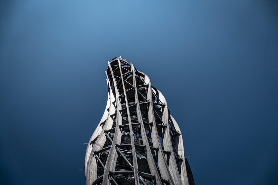 modern curved gray structure with clear skies