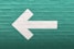 selective focus photography of white arrow signage