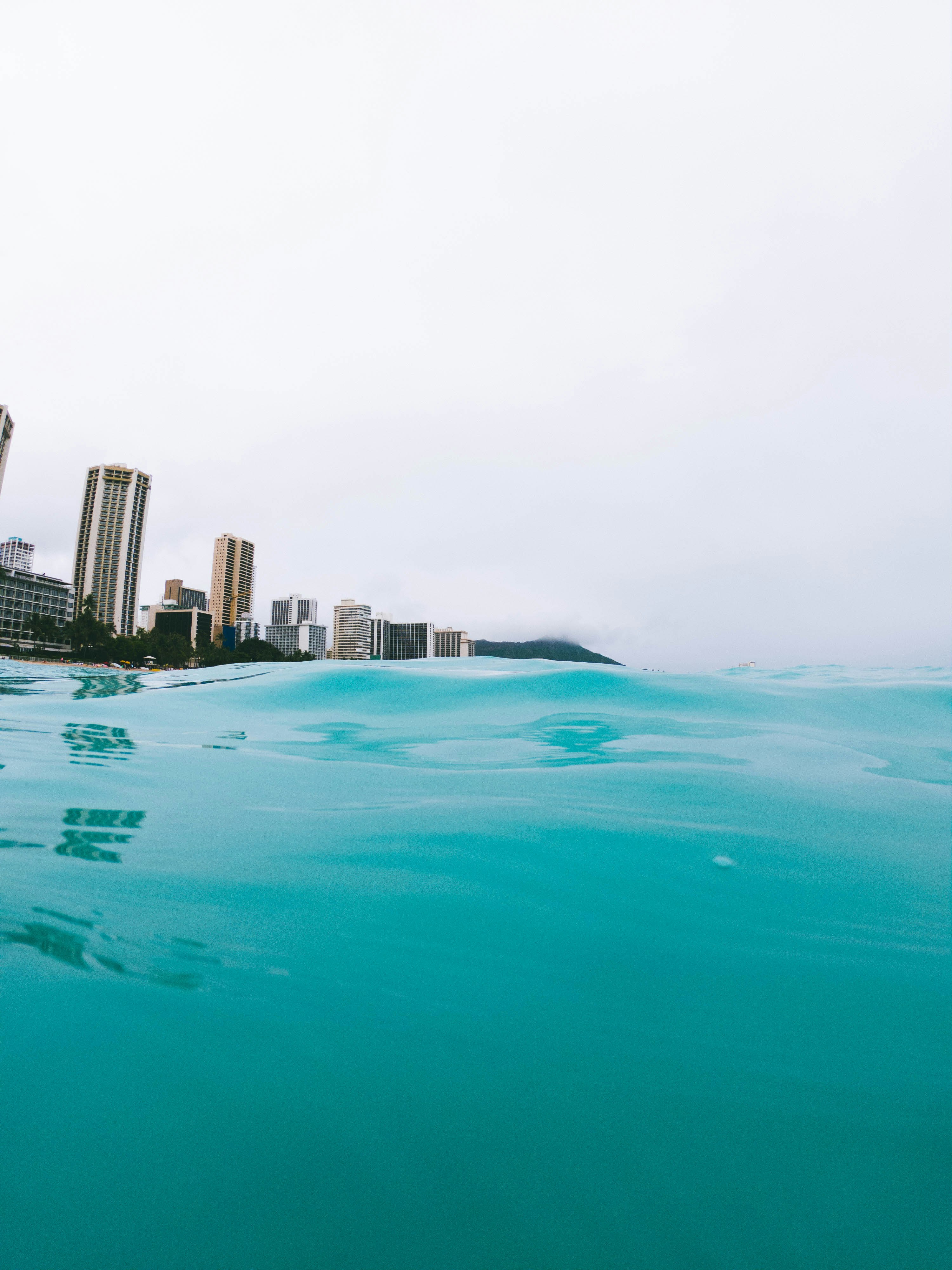 clear blue sea near high rise building