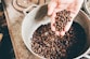 coffee beans on gray steel wok