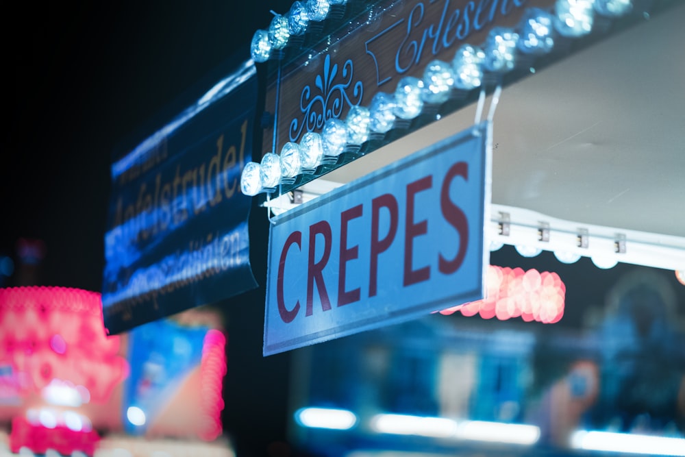 white and red Crepes signage