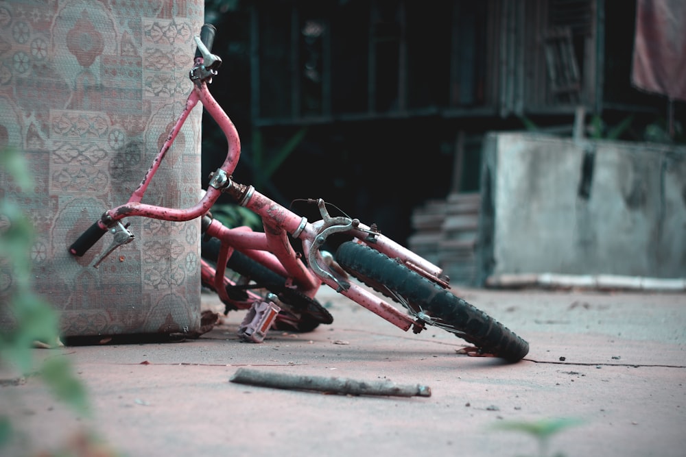 pink bicycle on brown concrete floor