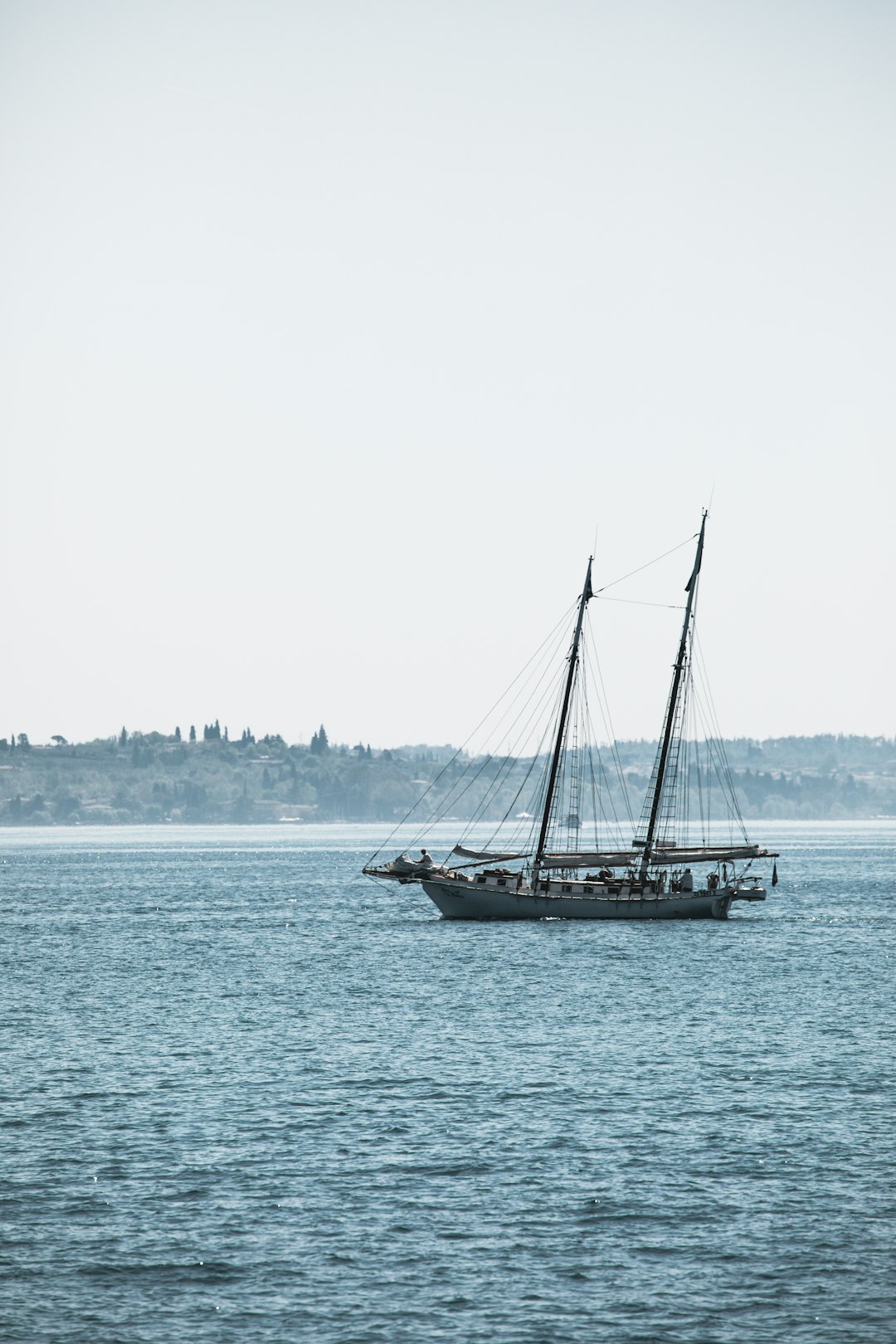 white ship sailing on body of water