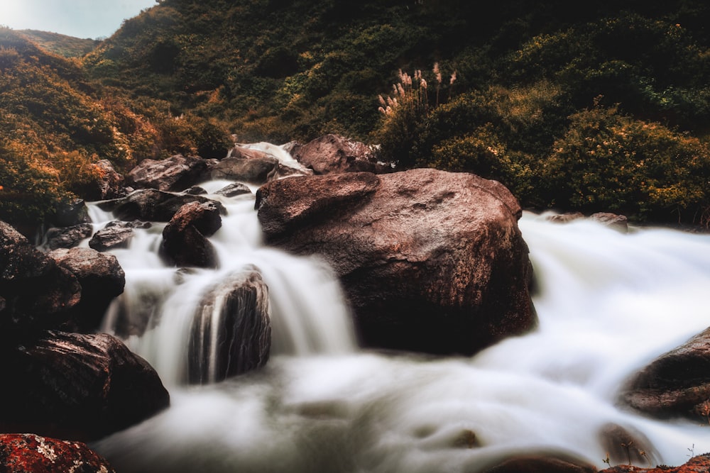 time lapse photography of waterfalls