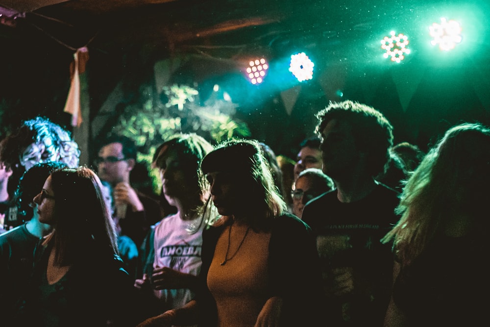 people inside the club with disco lights