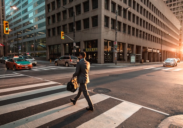 man crossing pedestrian lane