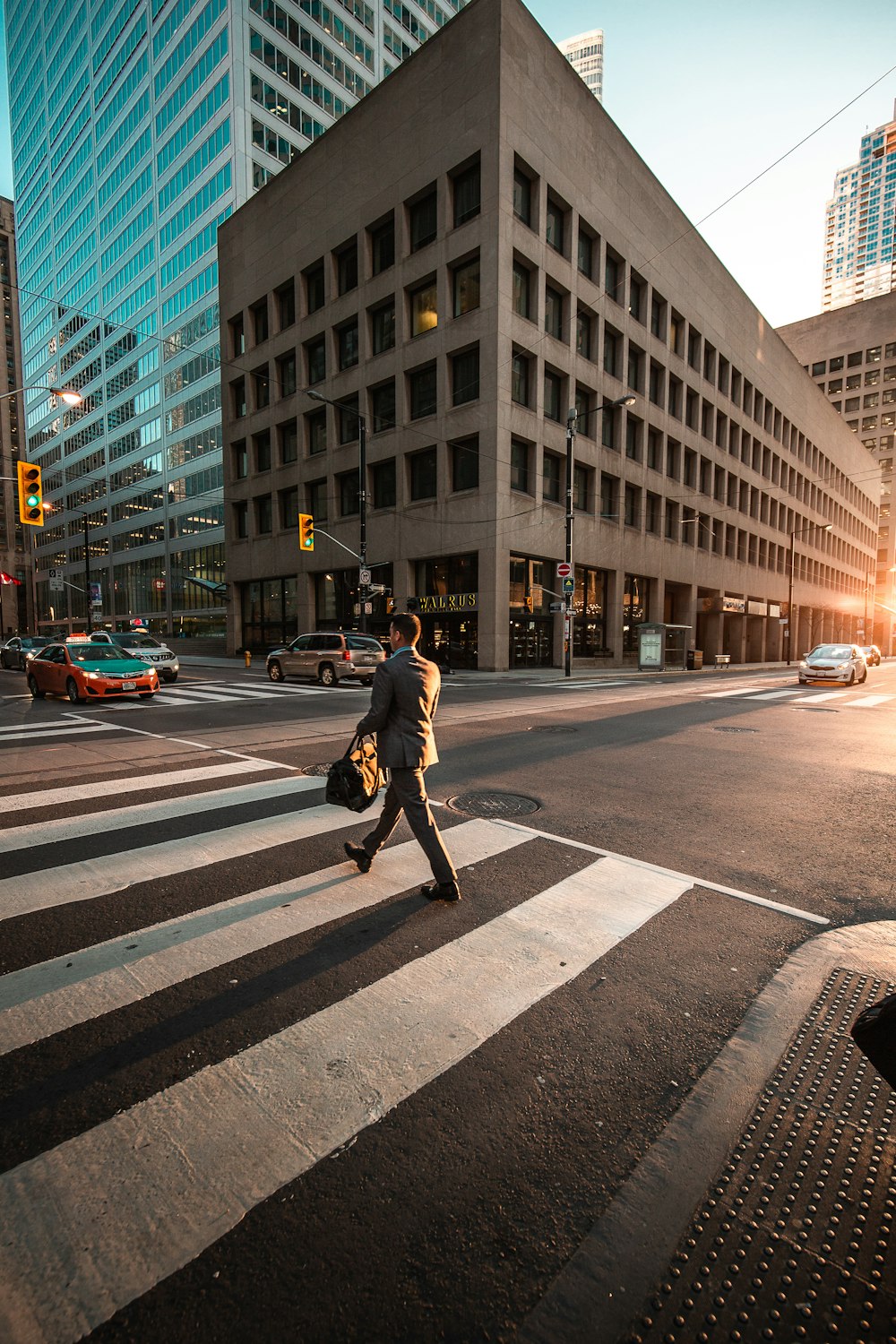 man crossing pedestrian lane