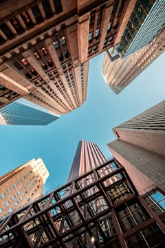wormseye view of high-rise buildings under blue sky