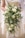 woman holding white roses bouquet