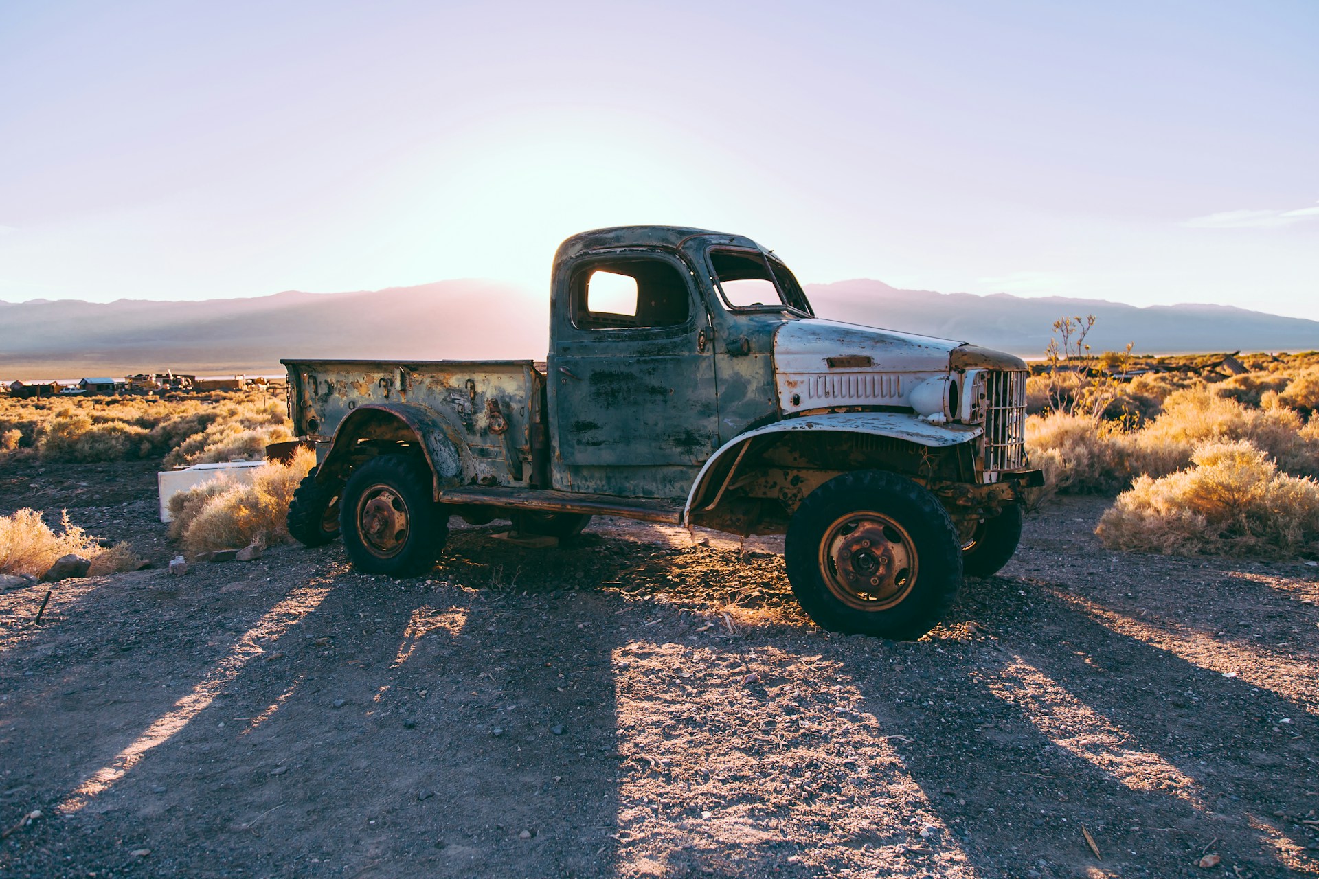 gray single cab truck on brown farm